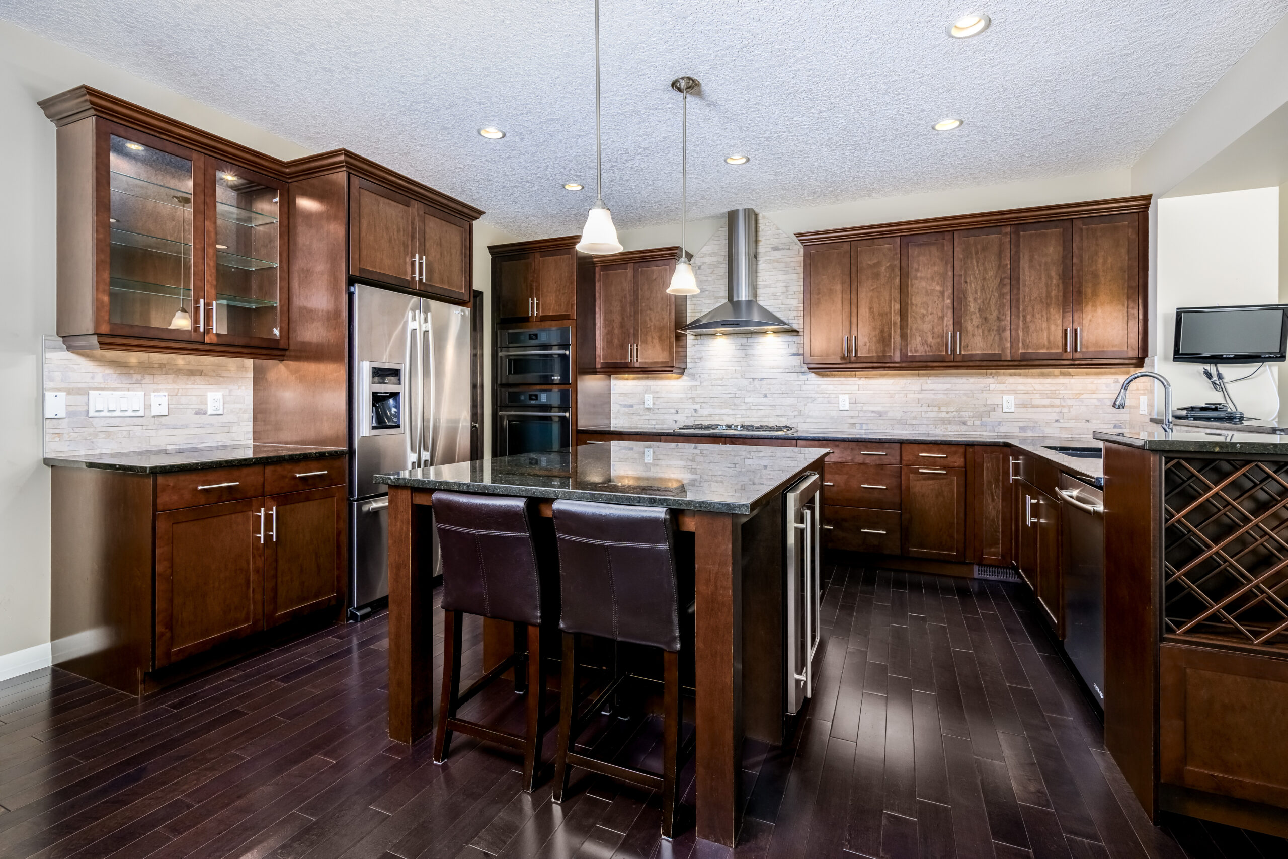 Kitchen with dark wood cabinets